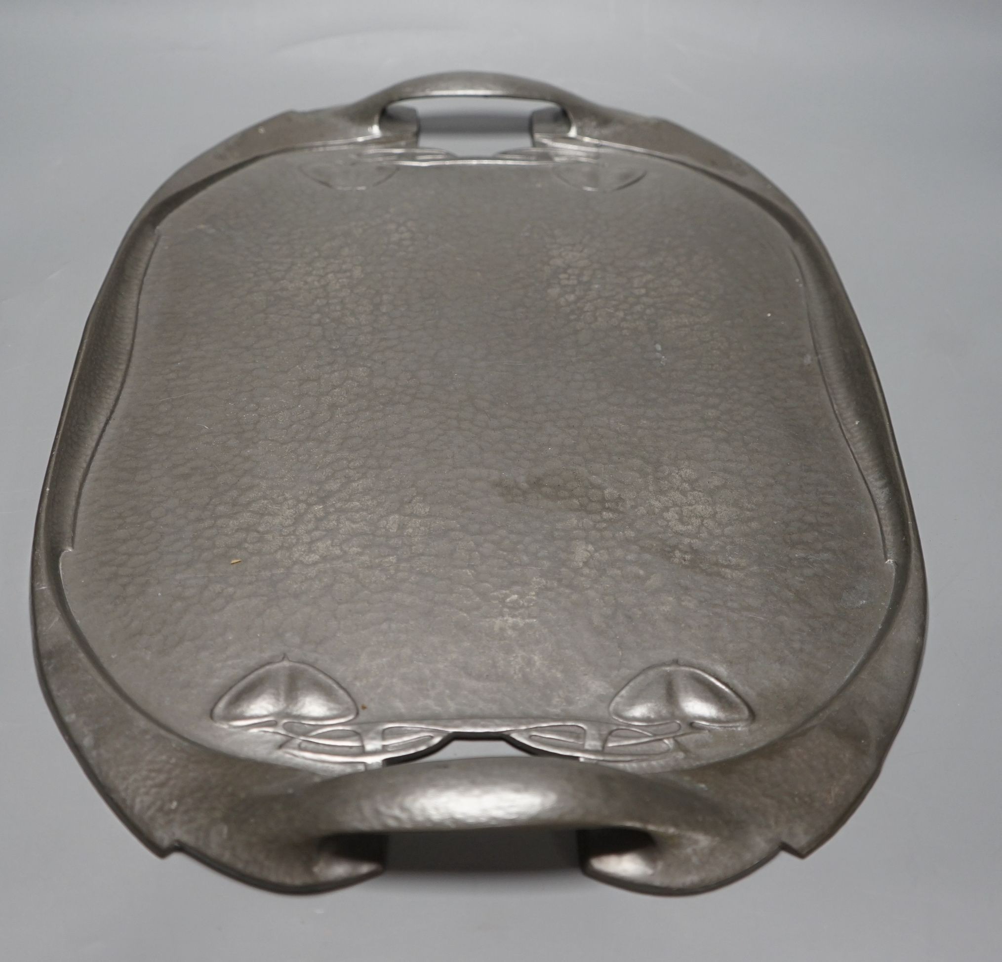 A Liberty's Tudric hammered pewter tray designed by A. Knox, 49cms wide